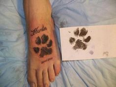 a person with a dog paw tattoo on their foot and the name hunter next to it