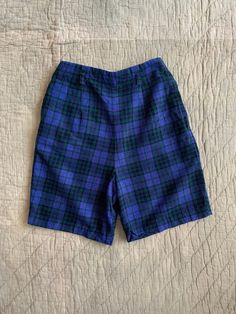 Vintage blue and green plaid thin corduroy shorts from the 1950's, with a side zip, super soft and comfortable. No flaws to note. Fits best a 24" waist. Measured flat: Waist 12" Rise 13.5" Hips 18.5" Inseam 6.5" PLEASE READ! *MEASUREMENTS* All items are measured while laying flat and unstretched. For clothing: chest, waist, hip and thigh measurements should be multiplied by two. All measurements are in inches. *VINTAGE CONDITION* Vintage goods may show signs of wear and age. We always indicate and/or show in pictures any major flaws or blemishes, but will not always mention small flaws, such as pinpoint sized spots or holes. If you are concerned about a particular item's condition, please message us. All of our pieces are pre-owned. We use a natural detergent to wash all our textiles when Plaid Boxers, Green Tartan, Corduroy Shorts, High Waist Shorts, Plaid Shorts, Green Plaid, Tartan Plaid, Small Waist, Blue Plaid