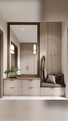 a large mirror sitting on top of a wooden cabinet next to a bench in a bathroom