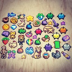 a bunch of pixelated objects are laying on the floor in front of a wooden table