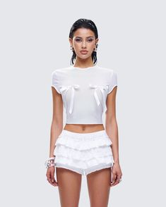 The bows were placed very intentionally 😜 Be the gift that keeps on giving in fitted this white baby doll tee made from mesh fabric and complete with white bow details 🤍 Graphic Top, White Jersey, Ruffle Shorts, White Bow, Mini Wrap Dress, Black Ruffle, The Gift, Baby Doll, Mesh Fabric