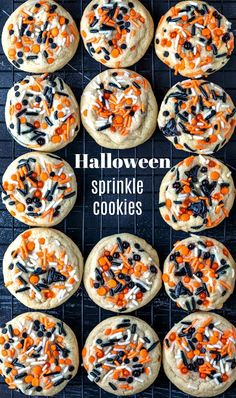 halloween sprinkle cookies on a cooling rack with white chocolate chips and orange candy