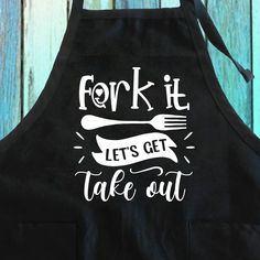 a black apron that says fork it let's get take out