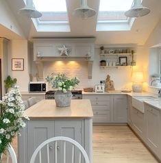 a kitchen filled with lots of counter top space next to a dining room table and chairs