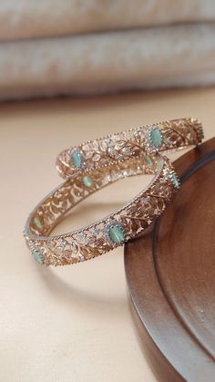 Designer Fashion Jewelry Exclusive Rose Gold with Mint Stones American Diamond CZ Bangles | Ethnic Rose Gold Tone AD Mint green Bangles Making Time 10-15 Days Size Available  2.6 In Personal trust me this is so much beautiful and in great quality nath, video call also available too see our products. Fashion Empire Studio gives you new look, Made of high quality material(s).  This is very Designer, Tradition Kada . Every Women wants Wear Something new and Stylish Items so this is only for u. Its A Choice Of Many Bollywood Celebrities. Trust me, it is more Beautiful in Real another the Picture  Designed By Master Craftsmen. Based On Indian beautiful Jewelry with a touch of the a contemporary art. Close Up Pictures Taken To Show Details In Item, So Item May Looks Larger. Please Read Above Des Kada Design For Women, Green Bangles, Indian Bracelets, Cz Bangles, Jelly Bracelets, Fashion Empire, Colorful Bangles, American Diamond Jewellery, Bangles Making