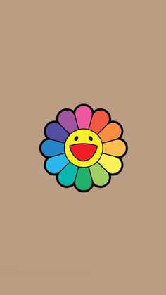 a colorful flower with a smiley face drawn on it's back side and the bottom half