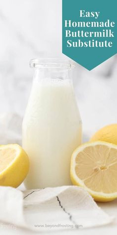 a bottle of homemade buttermilk next to lemons and a glass of milk