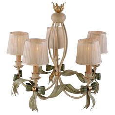 a chandelier with four lamps on top of it