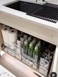 a kitchen sink filled with lots of toilet paper