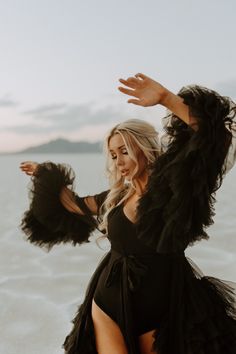 Model wearing black textured robe gown on bonneville salt flats, Utah Desert Fashion Photography, Editorial Bride, Boone North Carolina, Western Photoshoot, Big Dresses