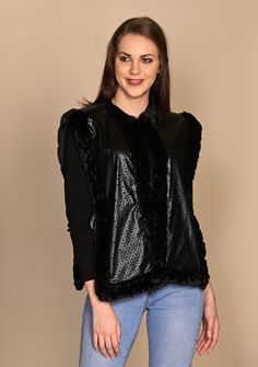 Looking for something unique and stunning that no one else has? The Andrea from Maneesha Ruia is what you must get. This is an open sleeveless jacket made from a combination of black lazercut faux leather front panels and a charcoal melange knitted fine wool back. With partly tonal and partly contrasting black faux fur trimming on the neck and border, this vest-like jacket can amp up any casual or formal wear. Black Winter Vest For Night Out, Black Vest Outerwear For Night Out, Chic Black Sweater Vest For Winter, Black Vest For Night Out In Fall, Fall Party Outerwear Vest, Black Fall Party Vest, Black Party Vest For Fall, Sleeveless Jacket, Black Faux Fur