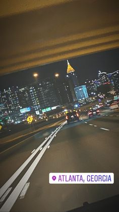 the city lights shine brightly at night from an overpass in atlanta, ga usa