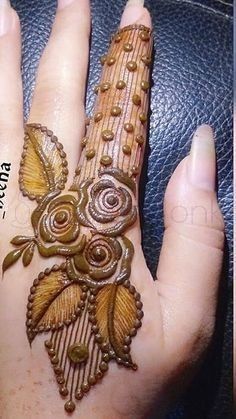 a woman's hand painted with hendi designs