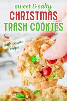 a hand holding up a christmas cookie with green and red sprinkles