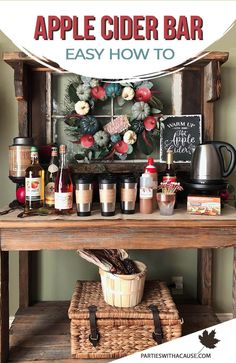 an apple cider bar with apples, cinnamons and other drinks on the table