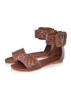 These leather sandals are made to order from high quality soft leather. Delight in the craftsmanship of these jaw dropping Madagascar leather sandals. Featuring woven leather upper with braided accents and large decorative leather bound buckle these sandals will keep you sleek and chic anywhere you go. Style them with your mini wrap dress to elevate your everyday casual look or with your floaty maxi skirt for a super chic style. -Smooth leather lining and insole with embossed logo -Lightly padde Brown Leather Braided Sandals, Brown Bohemian Flat Heel Sandals, Brown Bohemian Flat Sandals, Braided Leather Ankle Strap Sandals, Leather Woven Huarache Sandals With Ankle Strap, Leather Woven Ankle Strap Huarache Sandals, Bohemian Sandals With Ankle Strap And Leather Sole, Leather Sandals With Flat Heel For Festival, Bohemian Ankle Strap Sandals With Leather Sole