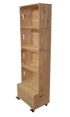 a wooden shelf with four drawers on wheels