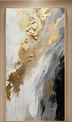 an abstract painting with gold and black colors on the wall in a living room setting