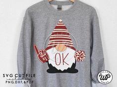 a gray sweatshirt with a red and white gnome on it