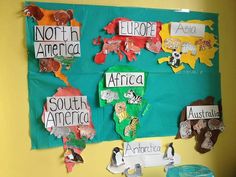 a bulletin board with different countries and animals on it, along with other magnets