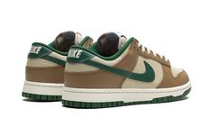 The Nike Dunk Low “Rattan/Gorge Green” is a colorway of the retro basketball shoe with earth and neutral tones on its design.  The “Rattan/Gorge Green” Dunk Low features a tan leather base contrasted with Rattan leather overlays.  A Gorge Green leather Swoosh appears on the sides, while more green detailing can be seen on the leather heel tab with “Nike” embroidery.  Gorge Green “Nike” and Swoosh logos appear on the tongue tag.  Underfoot, a Sail midsole and Gorge Green outsole complete the look.  Release date: March 1, 2024 Green Nike Shoes, Nike Embroidery, Sb Dunks, Retro Basketball Shoes, Retro Basketball, All Nike Shoes, Shoes Outfit Fashion, Cute Nike Shoes, Hype Shoes