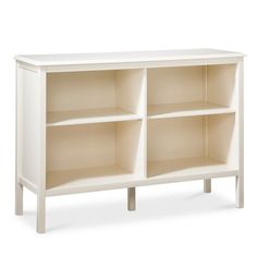 a white bookcase with four shelves on one side and two doors on the other