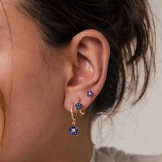 F L O W E R ∙ E A R R I N G ∙ S E T Add a touch of sweetness to any outfit with our Blue Flower Earring Set. Featuring three individual earrings, one stud and two hoops, you can mix and match how you want to wear them. The deep blue gemstones give an elegance while still capturing the youthfulness of the florals. * Material: High Quality Solid 925 Sterling Silver  * Finish:  18K Gold ∙ Sterling Silver * Featuring a Set of 3 CZ Gemstone Earrings:   1) ~9.5mm Dangling Lapis Lazuli Flower Charm Hug Earrings For Doubles, Blue Earring Stack, Caitlyn Minimalist, Earrings Sets, Flower Earring, Color Earrings, Gem Earrings, Floral Studs, Gemstone Stud Earrings