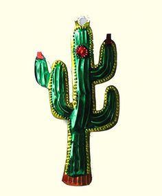 a green cactus with a red flower on it