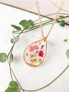 Preserved Wild Flower Pendant Necklace on 22k Gold Plated Fine - Etsy Gold Oval Pendant Jewelry With Pressed Flowers, Bohemian Gold Teardrop Pendant Drop Necklace, Gold Bohemian Teardrop Pendant Drop Necklace, Bohemian Gold Teardrop Pendant Necklace, Nature-inspired Gold Teardrop Pendant Jewelry, Nature-inspired Gold Necklace With Oval Pendant, Dainty Flower Necklace With Pressed Flowers, Gold Pendant Jewelry With Pressed Flowers, Teardrop Jewelry With Pressed Flowers