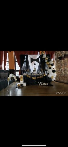 an image of a man in a tuxedo on display at a bar with drinks