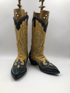 "Yellow and black men's cowboy boots, made from real leather, vintage style, embroidered with unique pattern, western style, fashionable streetstyle boots, cowboy boots, yellow and black color, has size 10 Description: - Sharp socks - Embroidered decorative stitching in black colors - The original embroidery on boots - On the both sides there are unique pattern - Leather inside and outside - No zippers and buckles - Delicate genuine vintage leather - Tabs on both sides of the boot shaft - Cowboy Western Hand Tooled Boots For Festivals, Hand Tooled Western Boots For Festival, Vintage Fitted Boots For Festivals, Vintage Fitted Festival Boots, Retro Fitted Boots For Rodeo, Retro Leather Boots For Rodeo, Retro Snip Toe Boots For Rodeo, Yellow Western Boots With Round Toe, Yellow Leather Boots With Snip Toe