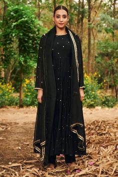 Black anarkali featuring scattered mirror work all over with kasap, pearl, pita, thread embroidery on the neckline and sleeve hem. Paired with a pant and a gota lace, tassel detailed dupatta. - Aza Fashions Unstitched Black Churidar With Cutdana Details, Black Churidar With Cutdana For Festive Occasion, Black Cutdana Churidar For Festive Occasions, Black Cutdana Churidar For Eid, Designer Black Anarkali Set With Cutdana, Black Straight Kurta Anarkali Set With Cutdana, Black Cutdana Anarkali Set With Straight Kurta, Black Anarkali Set With Cutdana For Designer Wear, Festive Black Anarkali Set With Cutdana