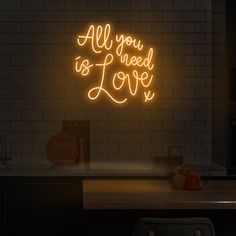 a neon sign that reads rose all day on the wall above a kitchen counter top