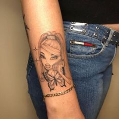 a woman with a tattoo on her arm