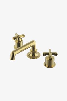 two brass faucets with handles on each side and one in the middle, against a white background