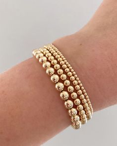 14k gold filled beaded stretch bracelet. Please measure your wrist and select your size in the dropdown as this bracelet is not one size fits all. SIZING TIP: To find out your bracelet size, wrap a piece of string around your wrist to measure (place it just above the wrist bone.) Then measure the length of the string. Then I'd recommend adding 0.8 inches (2cm) to that measurement to get your correct bracelet size. Gold Bracelet Preppy, Preppy Gold Bracelet, Ball Bracelet Gold, Gold Beaded Bracelets, Simple Beaded Bracelets, Bracelet Business, College Class, Preppy Bracelets, Preppy Jewelry