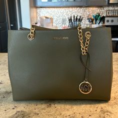 Michael Kors Olive Green Large Bag. Like New; Never Used. Green Michael Kors Purse, Chic Green Michael Kors Bag, Elegant Green Michael Kors Shoulder Bag, Snake Skin Handbag, Snakeskin Purse, Uniqlo Bags, Vintage Chanel Handbags, Michael Kors Selma, Michael Kors Purse