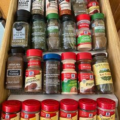 an organized spice rack filled with spices and seasonings