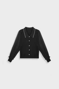 This professional women's blouse features a lapel collar with contrast trim, button detailing, and long sleeves. Made of 100% acrylic and available in both black and white. Fit Type: Regular Fit How it Fits: No Stretch Fabric: 100% Acrylic Care Instructions: 1.Hand Wash 2.Do not bleach 3.Dry flat in shade 4.Iron cool (max 110â„? 5.Dry clean, tetrachloroethylene(PCE) only Please note: The images represent actual product though color of the image and product may slightly differ. 2.How To Measure It Model is wearing: F SKU: 2104AA0555BKFSKU: ${data.sku} Fall Tops With Contrast Collar, Winter Office Top With Lapel Collar, Black Top With Striped Collar For Winter, Black Winter Top With Striped Collar, Black Collared Blouse For Office, Black Long Sleeve Blouse For Office, Winter Black Top With Striped Collar, Black Lapel Collar Blouse For Fall, Fall Long Sleeve Blouse With Striped Collar