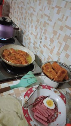 some food is sitting on the stove top and ready to be cooked in the oven