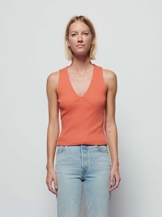 A familiar cut (without any of the fuss). It's a sleeveless tank with built-in bra cups and a halter-style front you love. (This one comes in Ginger.) | Women's Leticia Tank Top in Ginger | Ethical Essentials Bra-friendly Fitted V-neck Tank Top, Sleeveless Fitted Halter Top For Summer, Bra Friendly Fitted V-neck Tank Top, Chic Fitted Bra-friendly Tank Top, Fitted V-neck Bra Friendly Tank Top, Fitted V-neck Tank Top For Spring, Fitted Halter Top Tank For Spring, Chic Stretch Bra-friendly Top, Fitted Tank Halter Top For Spring