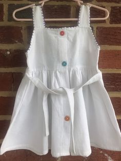 "Pit to pit 9 1/2\"/waist 9\"/length 17\"Top of shoulder strap to bottom of dress/Brand new no issues purchased on a trip long time ago/girls never wore them /hand embroidered / Smoke Free environment/labeled sz 0 (55!" Cotton Dresses With Buttons For Playtime, White Sundress For Playtime, White Cotton Sundress For Play, White Embroidered Dress For Playtime, Sleeveless Dress-up Dress With Buttons, Sleeveless Button-up Dress For Dress-up Occasions, Sleeveless Dress With Buttons For Dress-up, Sleeveless Dress With Buttons For Dress-up Occasions, Sleeveless White Sundress For Play