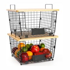 two metal baskets filled with fruit on top of each other