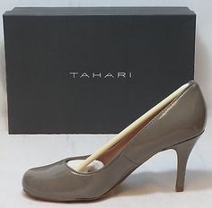 Sleek, chic and just your style, these Tahari pumps have been on your must-have list for years. Featuring a patent leather upper in a classic round toe design, these will be your new go to shoe! The tapered heel and rounded toe makes them wearable with everything—slacks, suits, skirts—and their classic design means you'll have them forever. Patent leather uppers Classic round toe design Patent wrapped heels 3 1/2 inch heel Shoes are BRAND NEW in the box. Sleek Chic, Sofft Shoes, Wrap Heels, Strap Pumps, 2 Inch Heels, Toe Designs, Dress Sandals, T Strap, Boot Shop