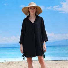 Who said cover-ups should be boring? Introducing the Deep V Cover Up in Black - a game-changer in fashion. Its deep V neckline adds a touch of intrigue while the flowing design promises comfort. Pair it with your trendy sunglasses and a statement hat for that perfect beach look or add chunky accessories for a fun night out. Embrace the unknown, embrace style! Chunky Accessories, Embrace The Unknown, Statement Hat, Walk On The Beach, White Beach, Trendy Sunglasses, Travel Fashion