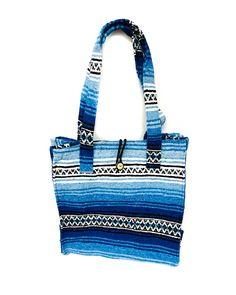 Mexican Blanket Tote Bag Handmade in Mexico Made from recycled materials Great for groceries, the beach, vacations, or as a purse! ** Each bag is handmade so there may be slight color variation from photos ** Blue Bohemian Gift Bag, Large Handmade Shoulder Bag For The Beach, Blue Handwoven Beach Bag For Travel, Eco-friendly Blue Beach Bag, Daily Use Handmade Blue Beach Bag, Blue Square Beach Bag For Vacation, Blue Square Bag For Beach, Summer Blue Handwoven Shoulder Bag, Blue Handwoven Summer Shoulder Bag