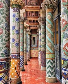 the columns are decorated with colorful designs and patterns, while the floor is tiled in different colors