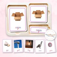 a wooden tray with four different cards on it, including an animal and the words caja