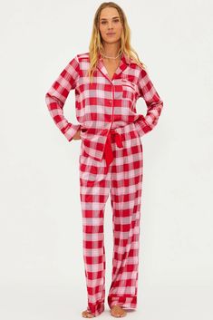 The Livy Top & Connie Pant Set is our new long-sleeve and pant pajama set, perfect for the holiday season. This PJ set is featured in a satin-like, lightweight, and breathable plaid-printed fabrication. It’s all in the details with a button-front top, front pocket, elastic waistband with an adjustable ribbon tie, and red piping. Our Candy Cane Plaid features rich shades of red and pink in a classic holiday plaid. Holiday Plaid, Beachwear Fashion, Beach Riot, Boys Swimwear, Sports Skirts, Outerwear Outfit, Sport Dress, Classic Holiday, Ribbon Tie