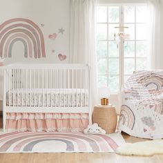 a baby's room with a crib, bedding and rugs on the floor